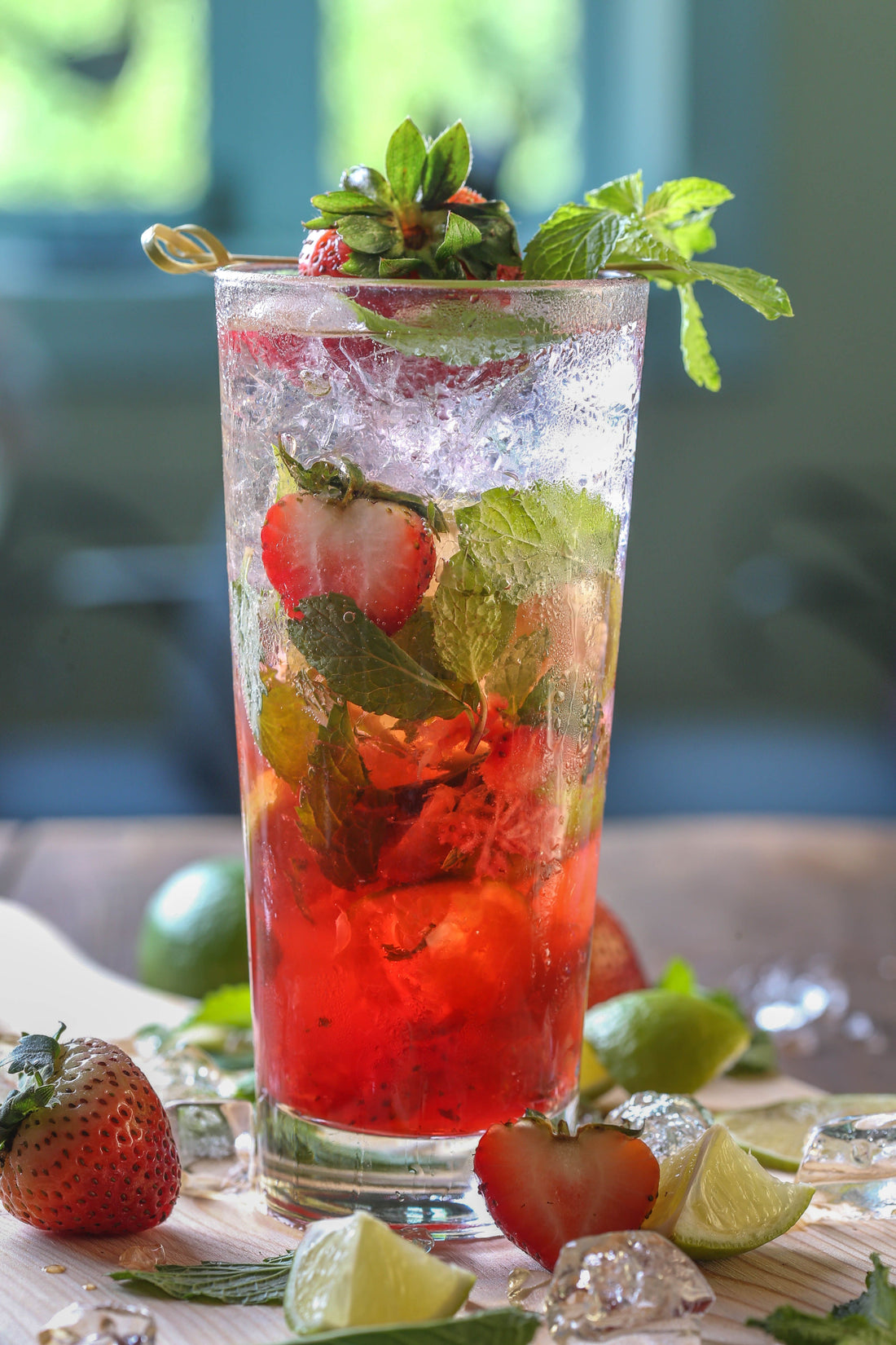 a coctail with saffron and mint and strawberry 