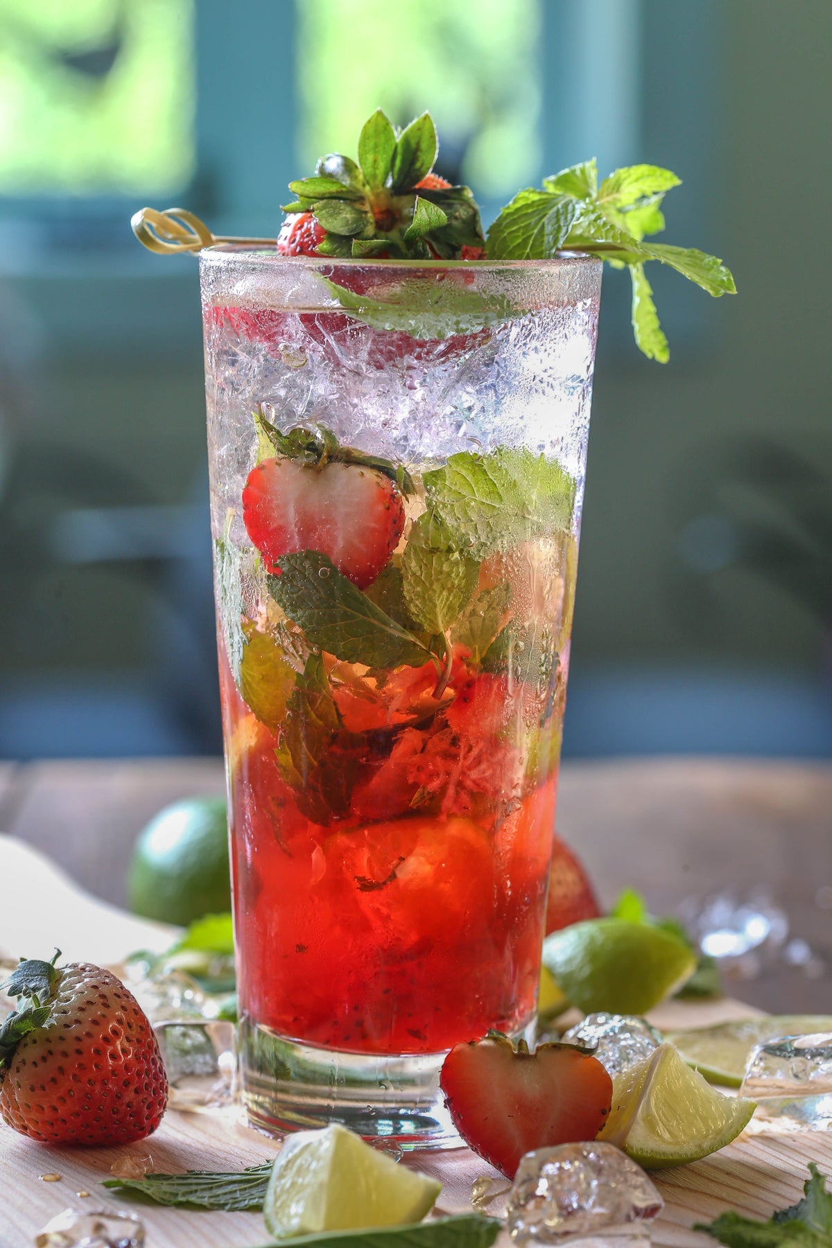 a coctail with saffron and mint and strawberry 